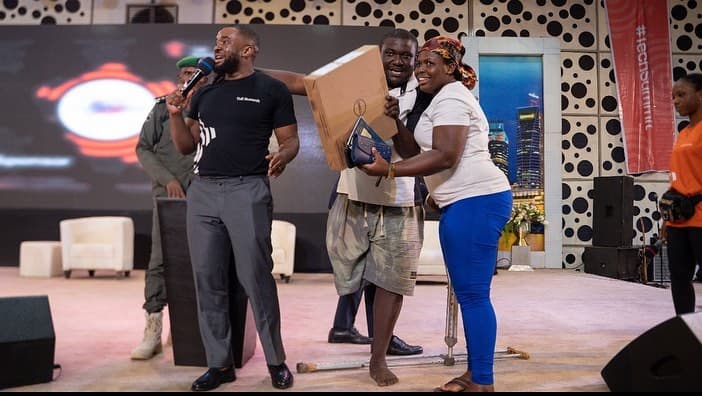 Williams presents a laptop on stage